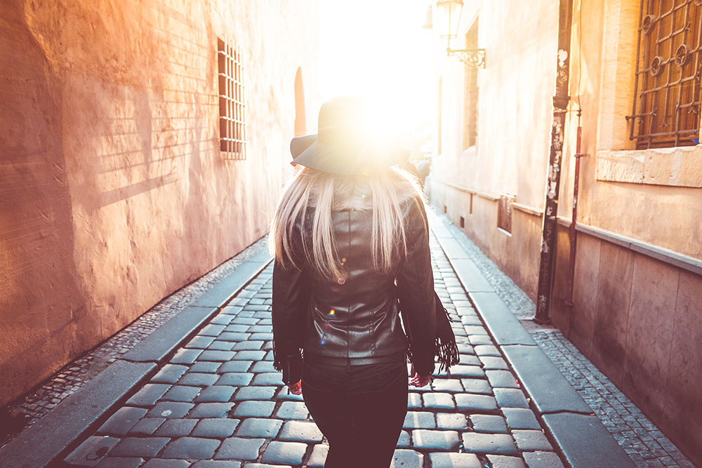 Young Woman Walking Alone in Prague Streets